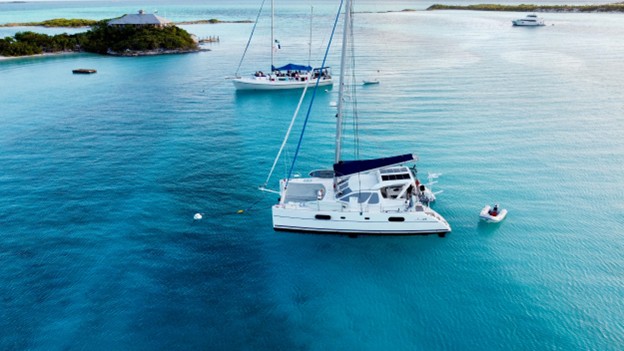 Little Cloud, our Catana 431 sailing catamaran, at anchor in the turquoise water of the Exumas, Bahamas