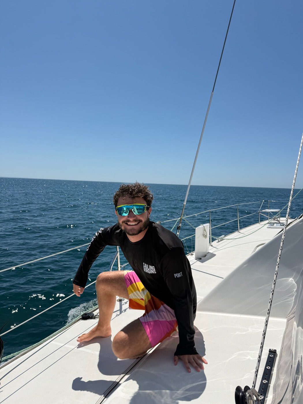 Sam, RYA Yachtmaster Offshore, on the foredeck of Little Cloud under sail